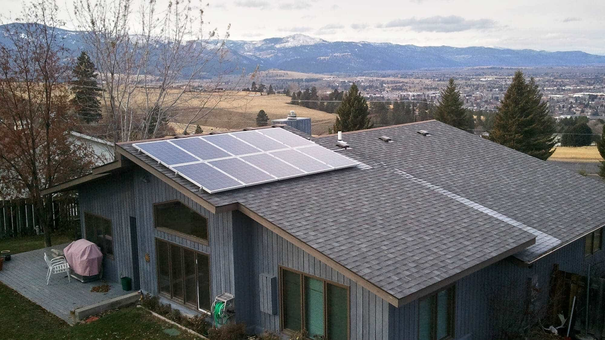 Solar panels and snow covered hills